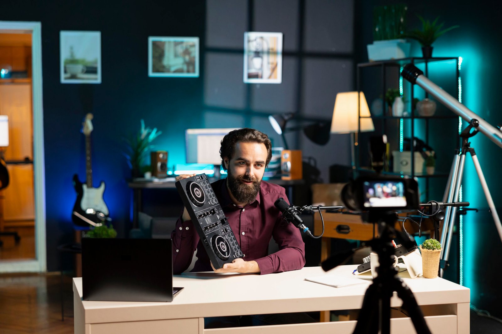 Man recording a product review video in a studio using a Video-Review-Marketing-Platform setup with camera, microphone, and lighting equipment.